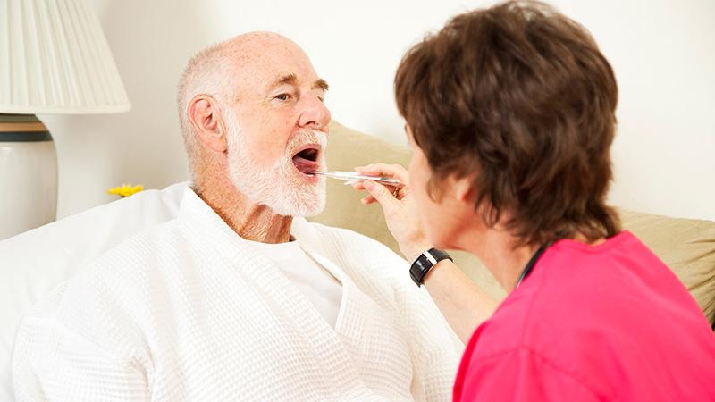 man having temperature checked